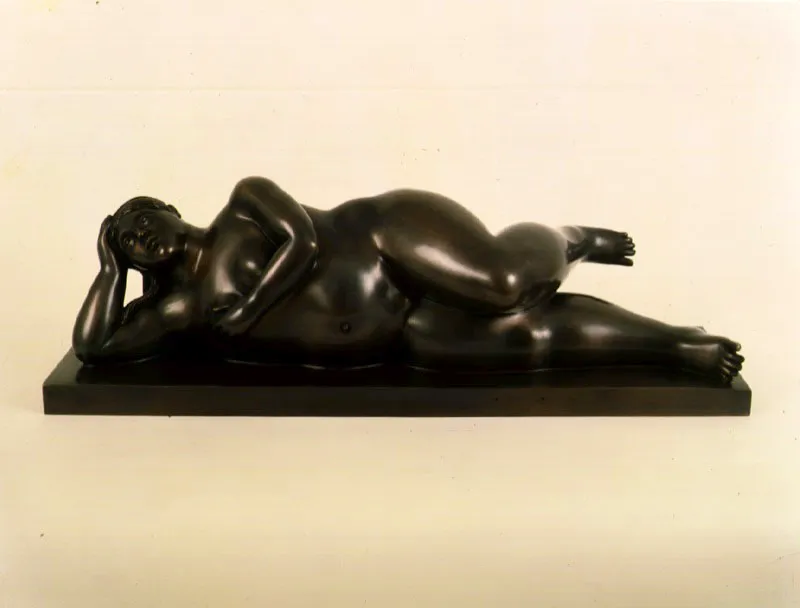 Mujer recostada.  
1996.  
Bronce, edicin de 6.  
64,5 x 19,8 x 21 cm.   