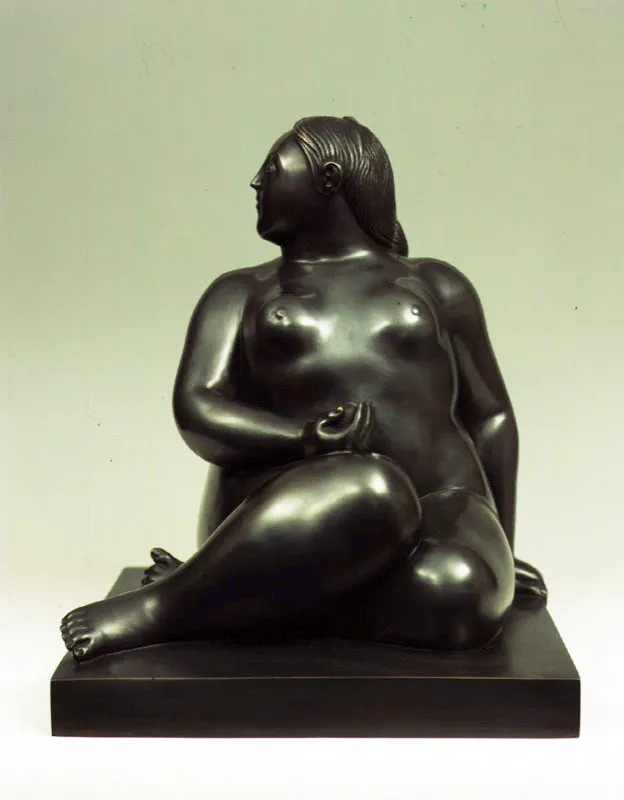 Mujer sentada.  
1996.  
Bronce.  
42 x 35,5 x 35 cm.   