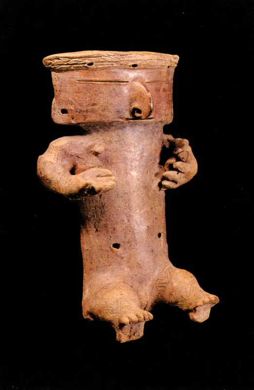 Figura antropomorfa. Quimbaya.
	20.8 x 13.2 cm. 