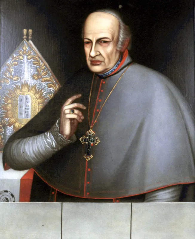 Taller de los Figueroa. Arzobispo Fernando Caicedo y Flórez, siglo xix.
Óleo sobre lienzo, 80 x 64 cm
Este retrato ha sido atribuido a Pedro José Figueroa (Bogotá, ca. 1770 - 1838). El personaje, Fernando Caicedo y Flórez (Suaita, Santander, 1756 - Bogotá, 1832), fue figura importante en el marco de las luchas emancipadoras. Exiliado y apresado durante la reconquista, Pablo Morillo lo describía como un “adicto a la independencia, funcionario en la revolución, dando impresos al público que atacan al soberano”. Caicedo y Flórez fue el primer rector de la Universidad Central (1826) y en varias ocasiones rector del Colegio Mayor de Nuestra Señora del Rosario. Aquí aparece de avanzada edad, su mirada penetrante interpela al espectador, así como el gesto de su mano que genera la impresión de que el personaje se encuentra a punto de decir algo. La composición general del retrato es bastante sosegada y presenta como puntos llamativos los detalles rojos del atuendo del clérigo y sobre todo la cruz sobre su pecho y el anillo en su mano, que han sido trabajados minuciosamente.