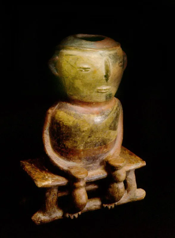 Figura antropomorfa sentada; pintura negativa. Quimbaya clsico.
 