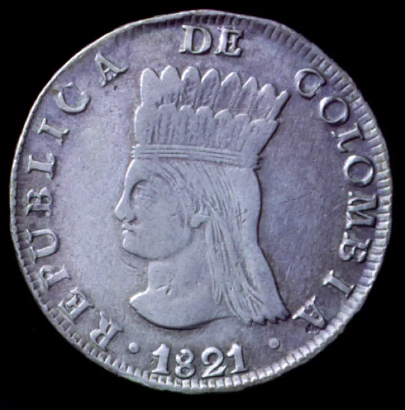 Monedas de la Gran Colombia: un real de plata, Bogot, 1821; ocho escudos de oro, Popayn, 1830. Las monedas de la Gran Colombia, reselladas, siguieron utilizndose en Venezuela y Ecuador una vez disuelta la Repblica.  