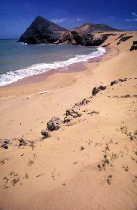 Cabo de la Vela, Guajira. 
Es el extremo ms septentrional de Amrica del Sur. Segn las creencias wayuu en este lugar est el camino de las almas, por donde los espritus de los guajiros inician su camino despus de la muerte hacia lo desconocido. Obligado destino turstico, su playa est entre el desierto y el mar. 