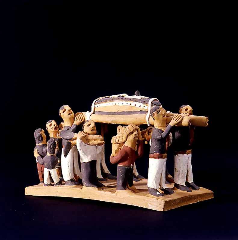 Representación funeraria en barro cocido. Desde las urnas funerarias precolombinas, hasta en este tipo de objetos, se manifiesta la importancia que las gentes de Colombia asignan a esta ceremonia. Teodolindo Ovalle. Ráquira, Boyacá. José Fernando Machado